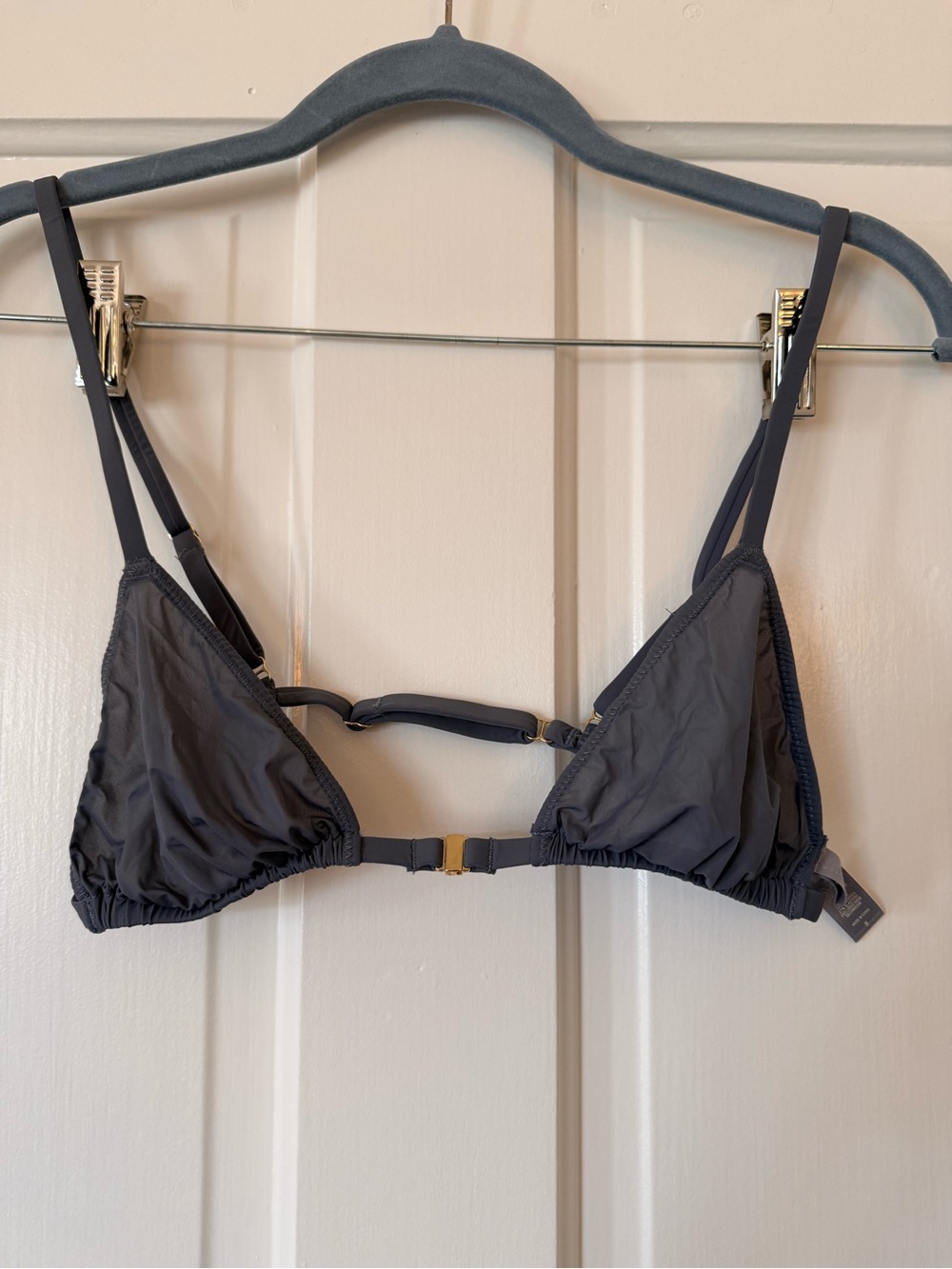 Skims sheer triangle bralette with gold accents.